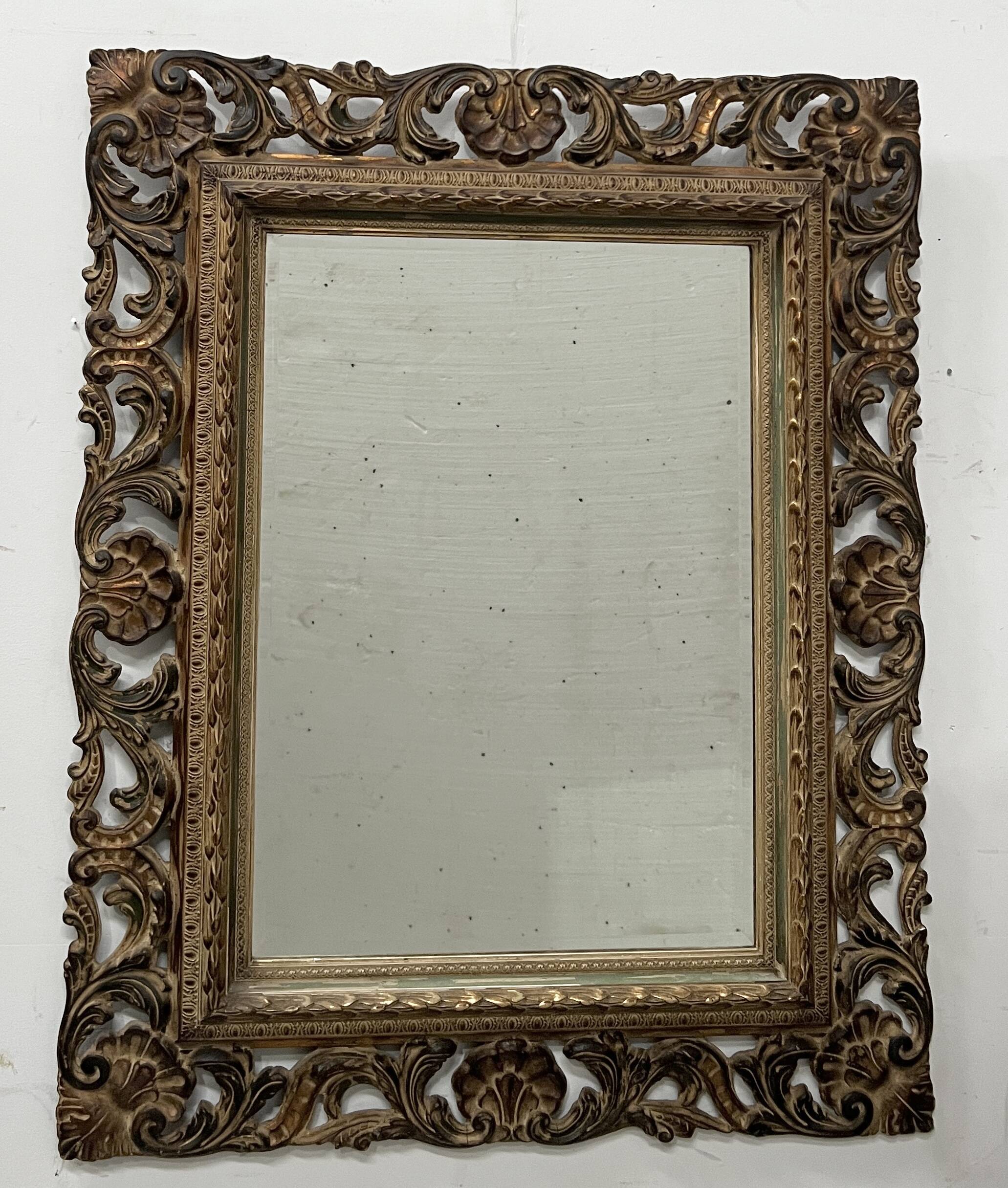 Napoleon III style mirror in carved wood, 20th century.