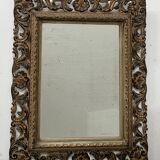 Napoleon III style mirror in carved wood, 20th century.