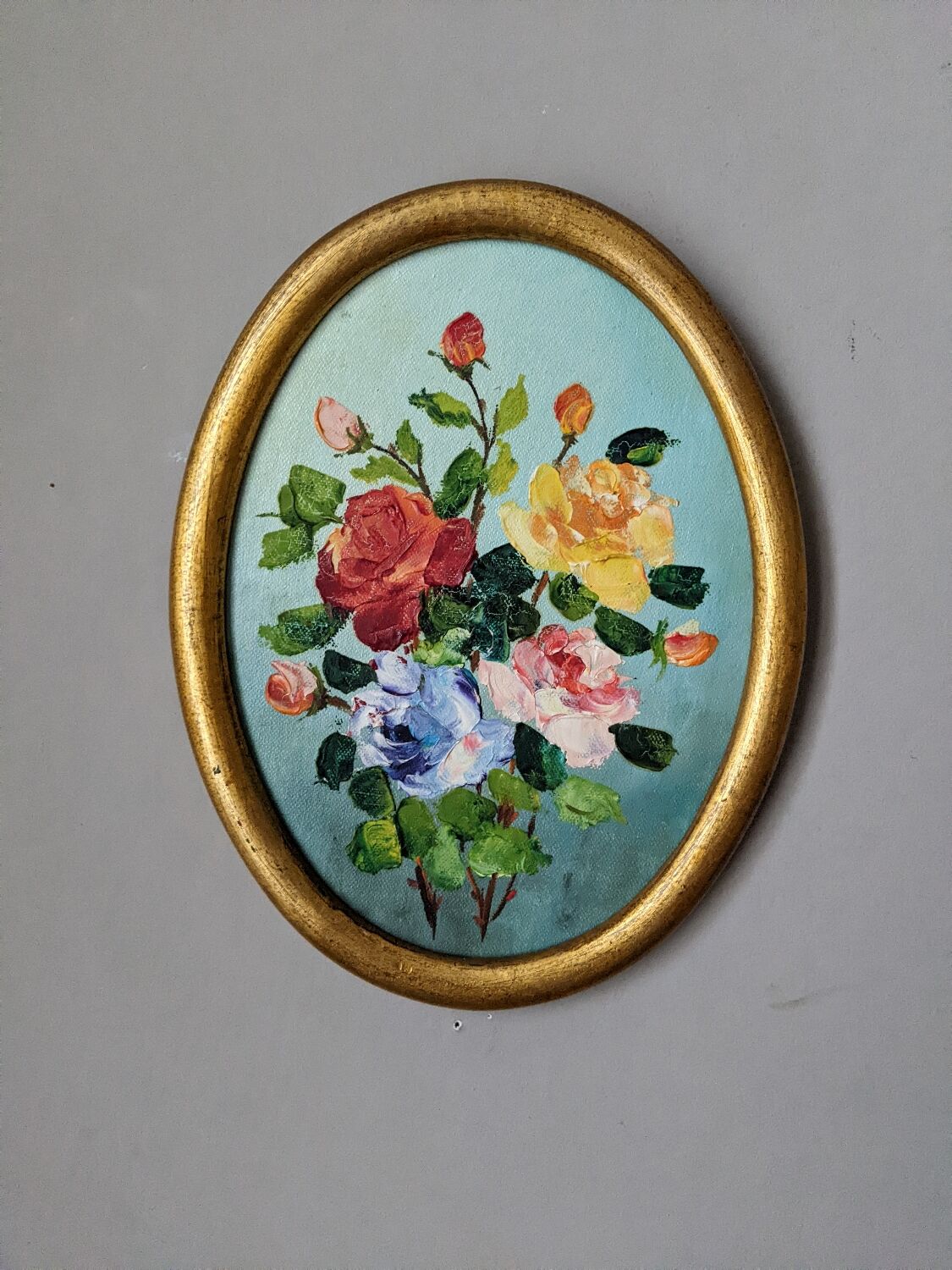 Old oval acrylic painting on gilded wooden panel.