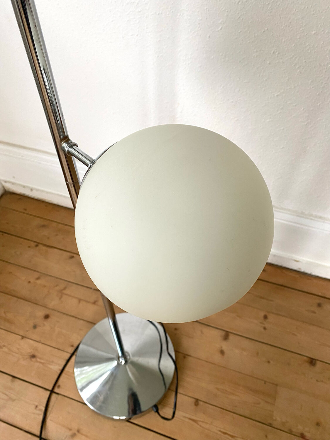 Vintage floor lamp has two opaque glass spheres