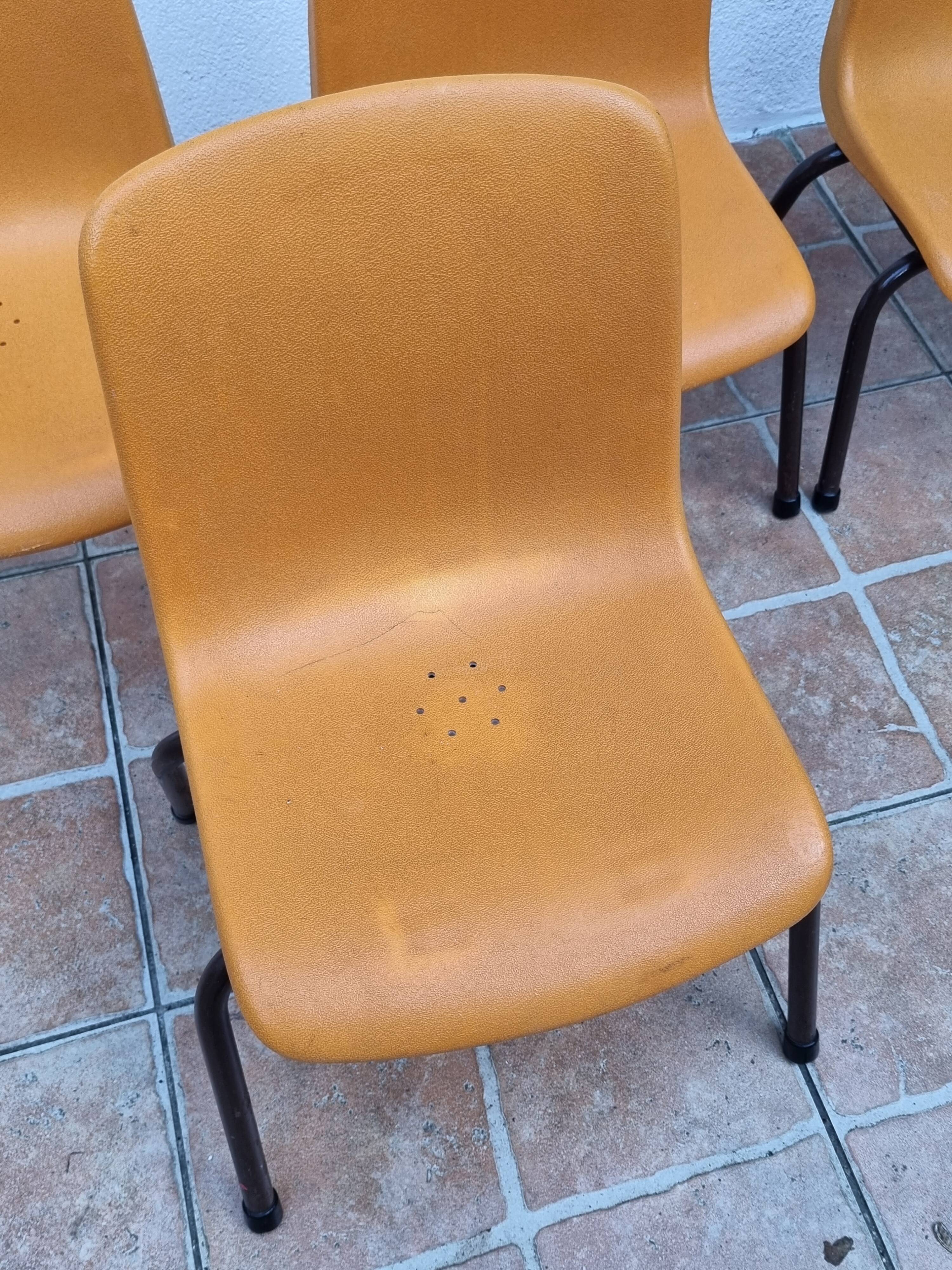 Set of 4 vintage Grosfillex school chairs, 60s-70s, orange plastic and tubular base
