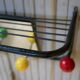 Vintage wall coat holder with 4 coloured balls, mirror and shelf