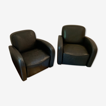 Deux fauteuils en cuir