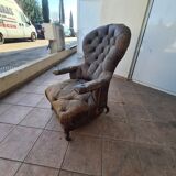 Chesterfield armchair with folding footrest