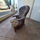 Chesterfield armchair with folding footrest