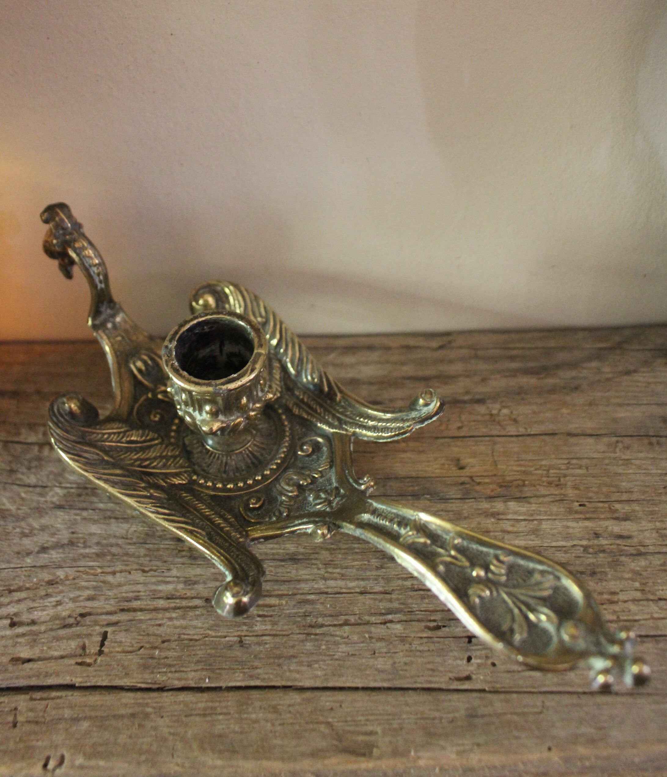 Brass candle holder cave rat peacock