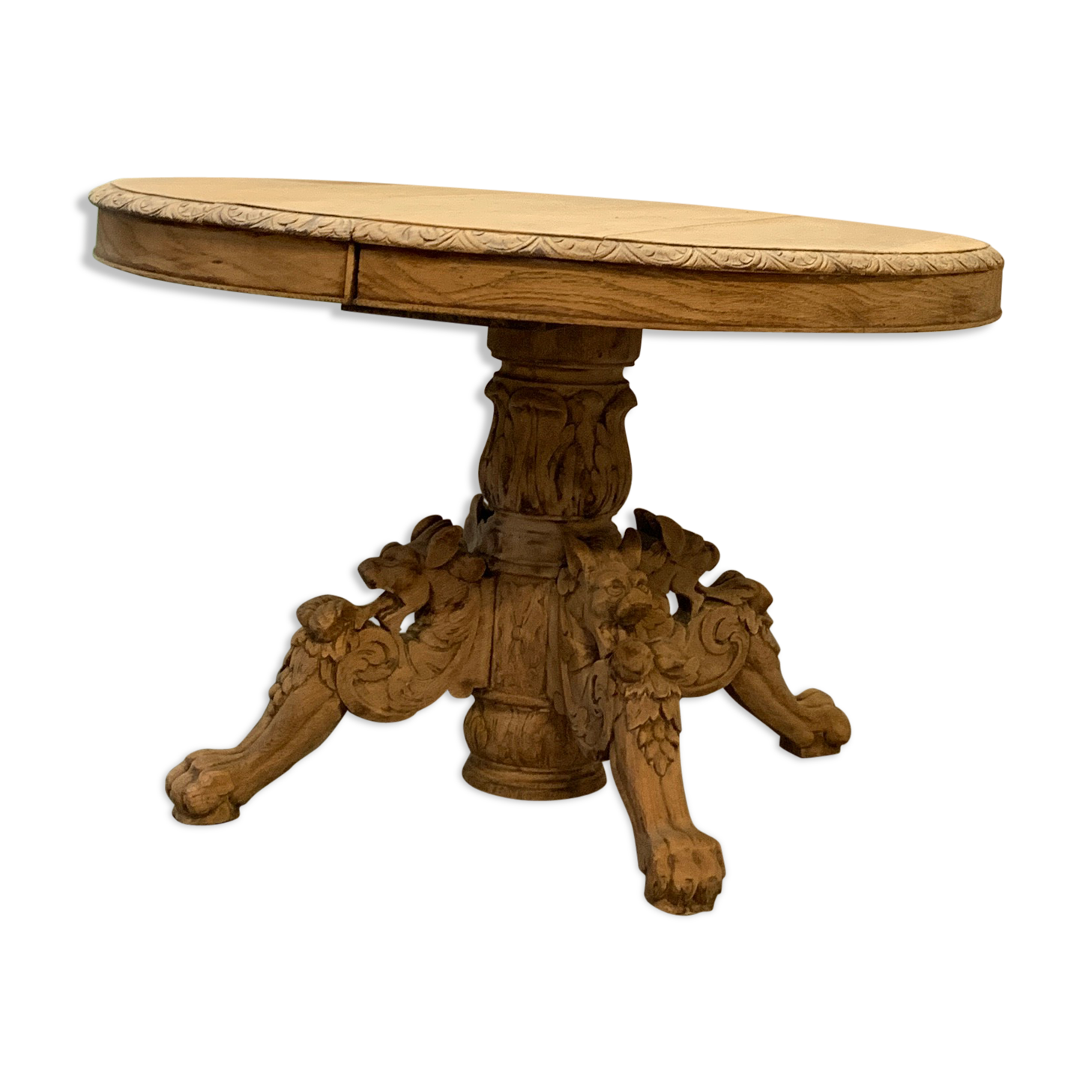 Table Henri II à pattes de lion en chêne brut extensible .