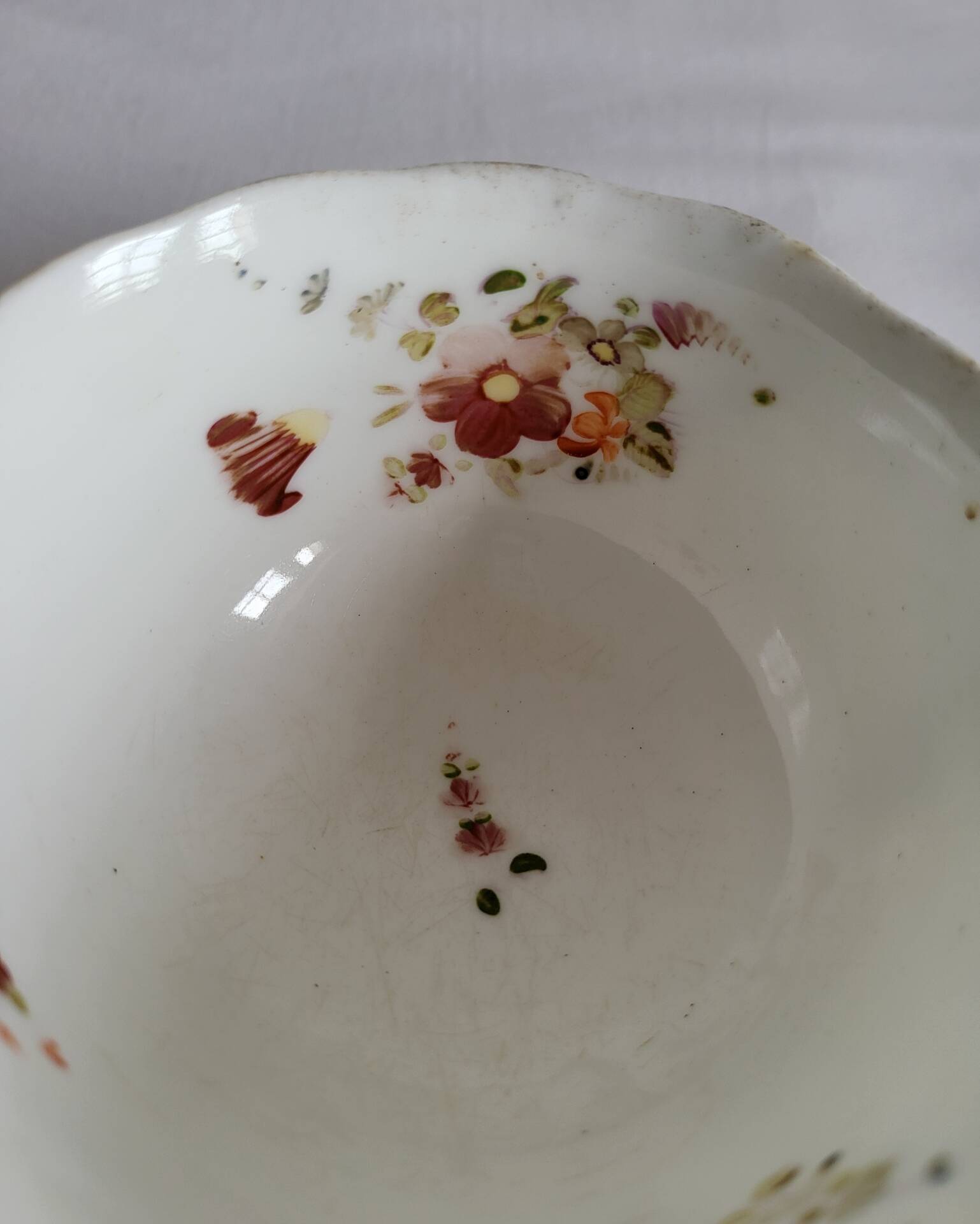 Antique Cup and Saucer in Porcelain with Hand-Painted Floral Decoration