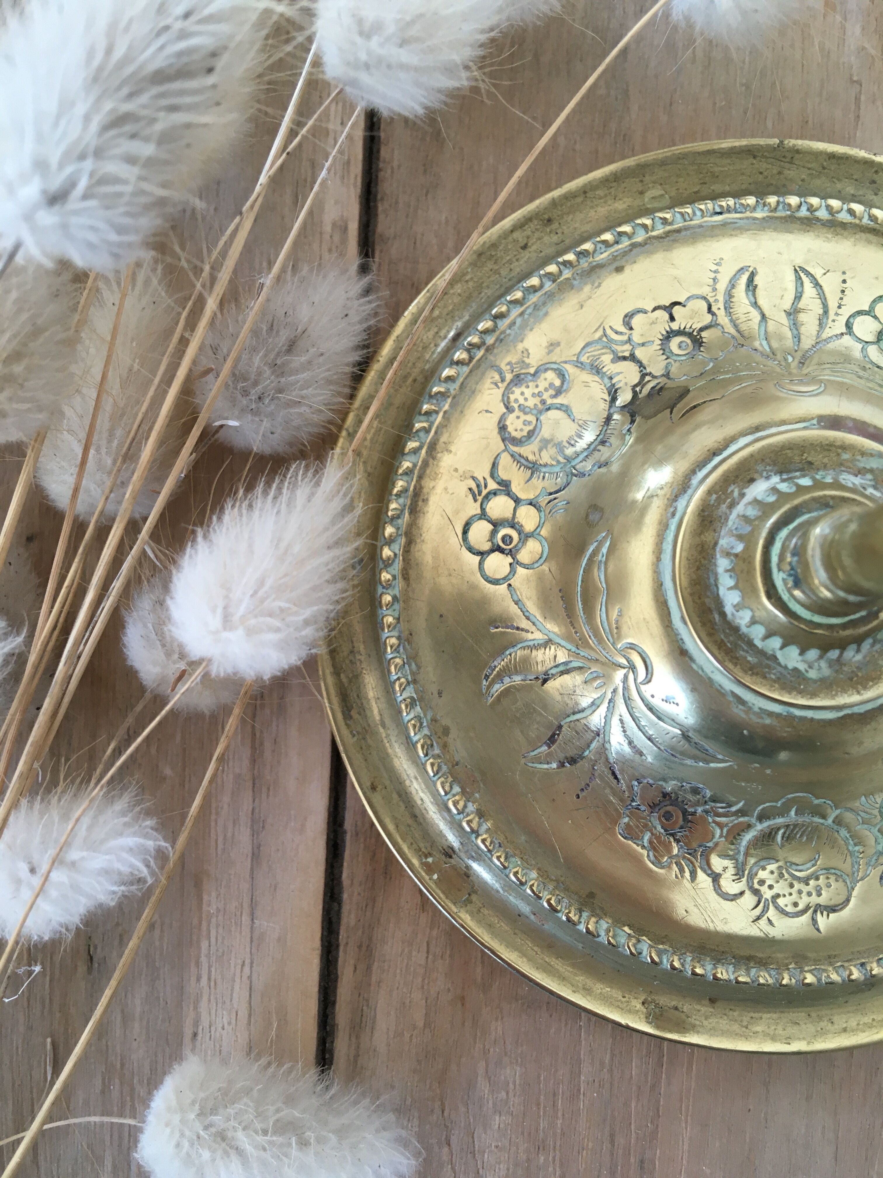 Chiseled brass candle holder