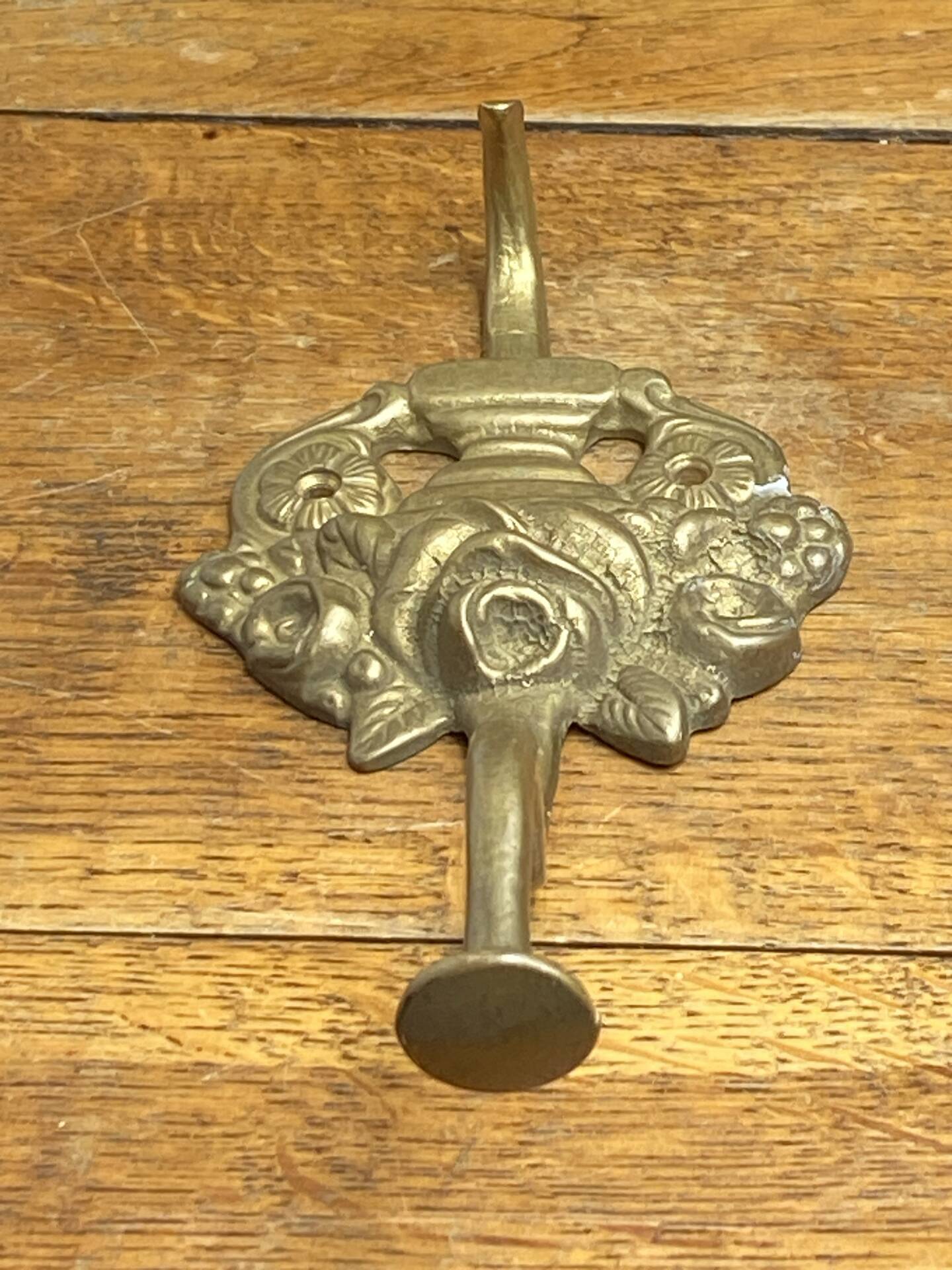 Wall-mounted brass hook