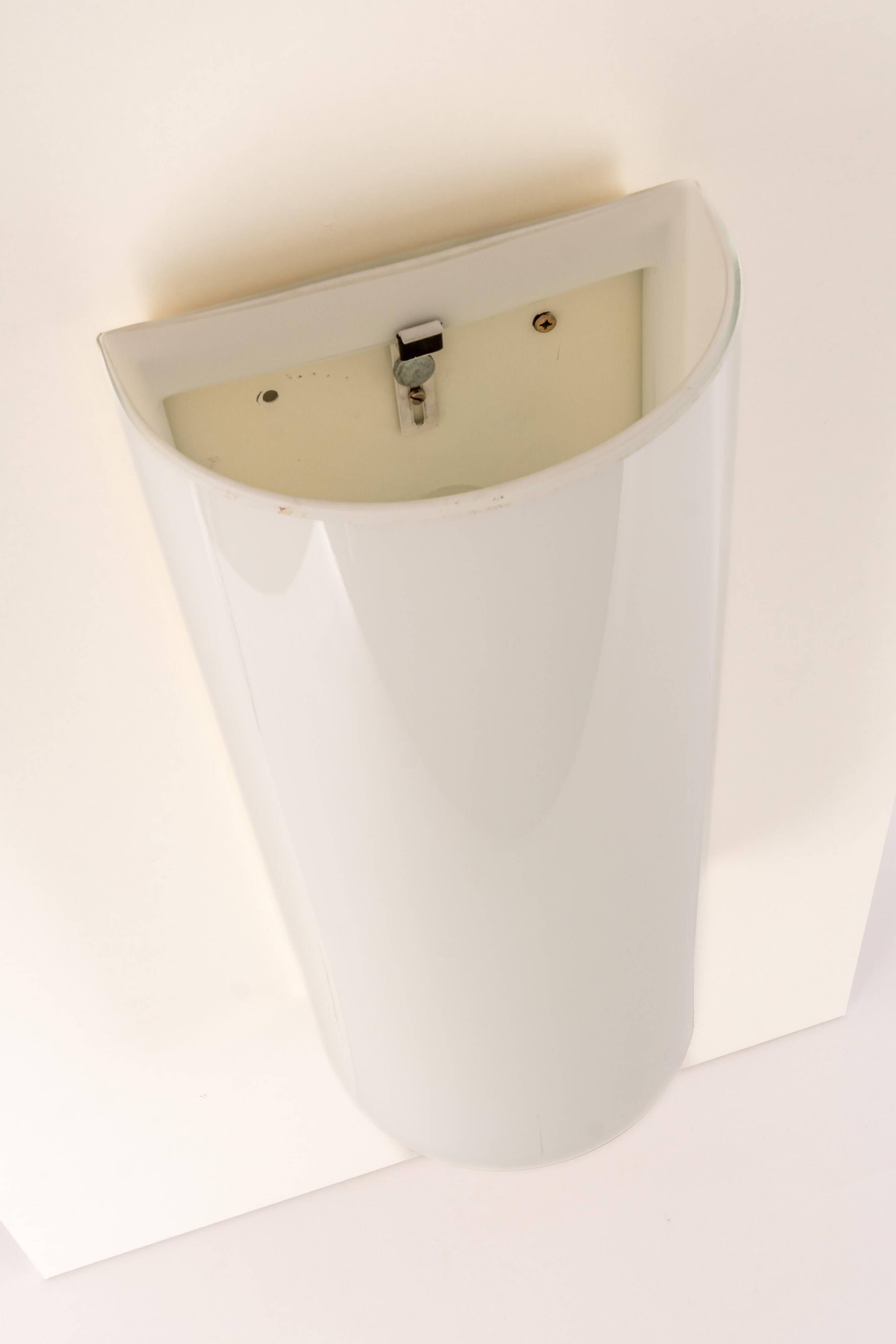 Pair of large opaline glass wall lights in brass designed by Limburg, Germany.