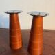 Pair of Guy Degrenne wooden and stainless steel candlesticks