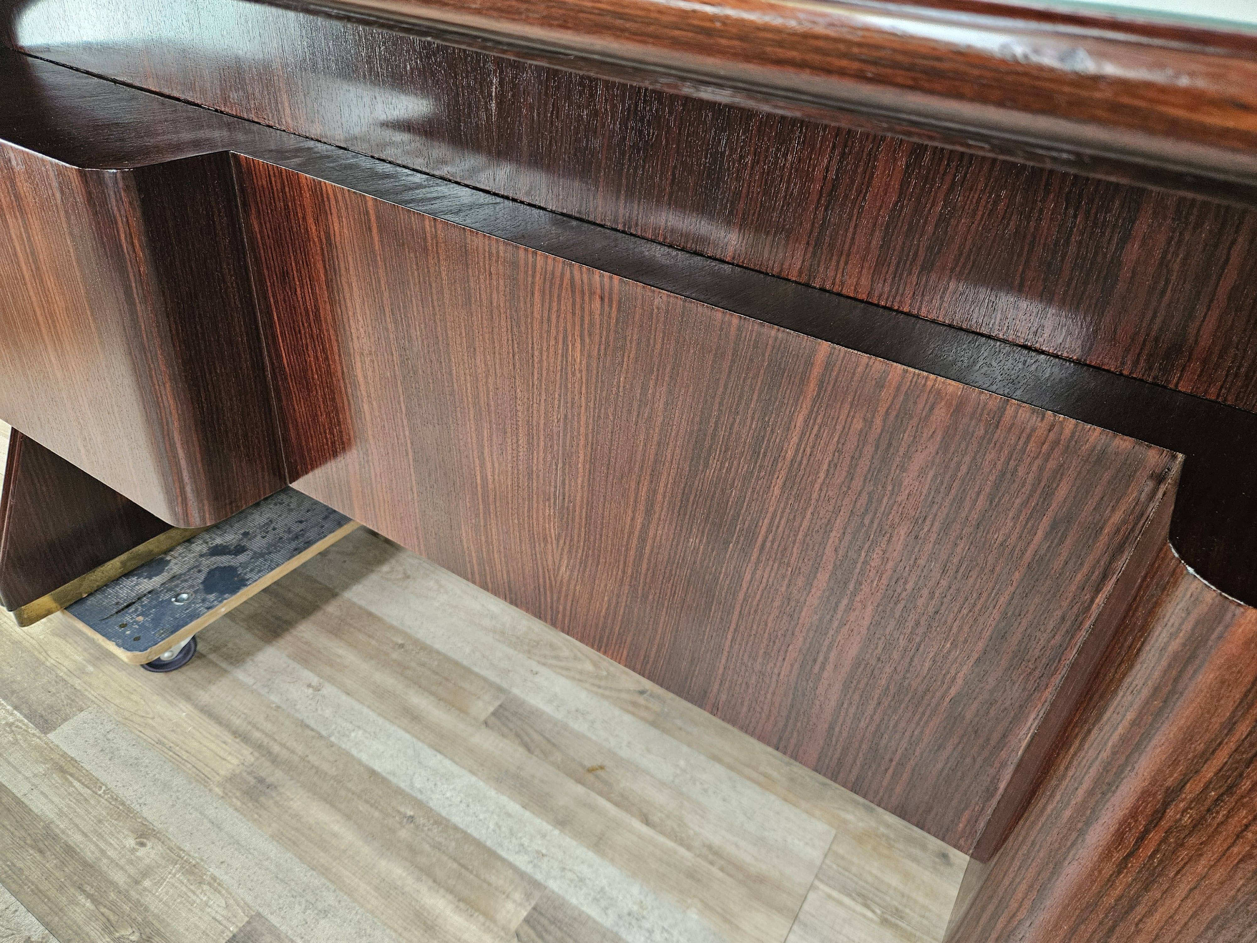Executive Art Decò desk in exotic wood, glass, and brass