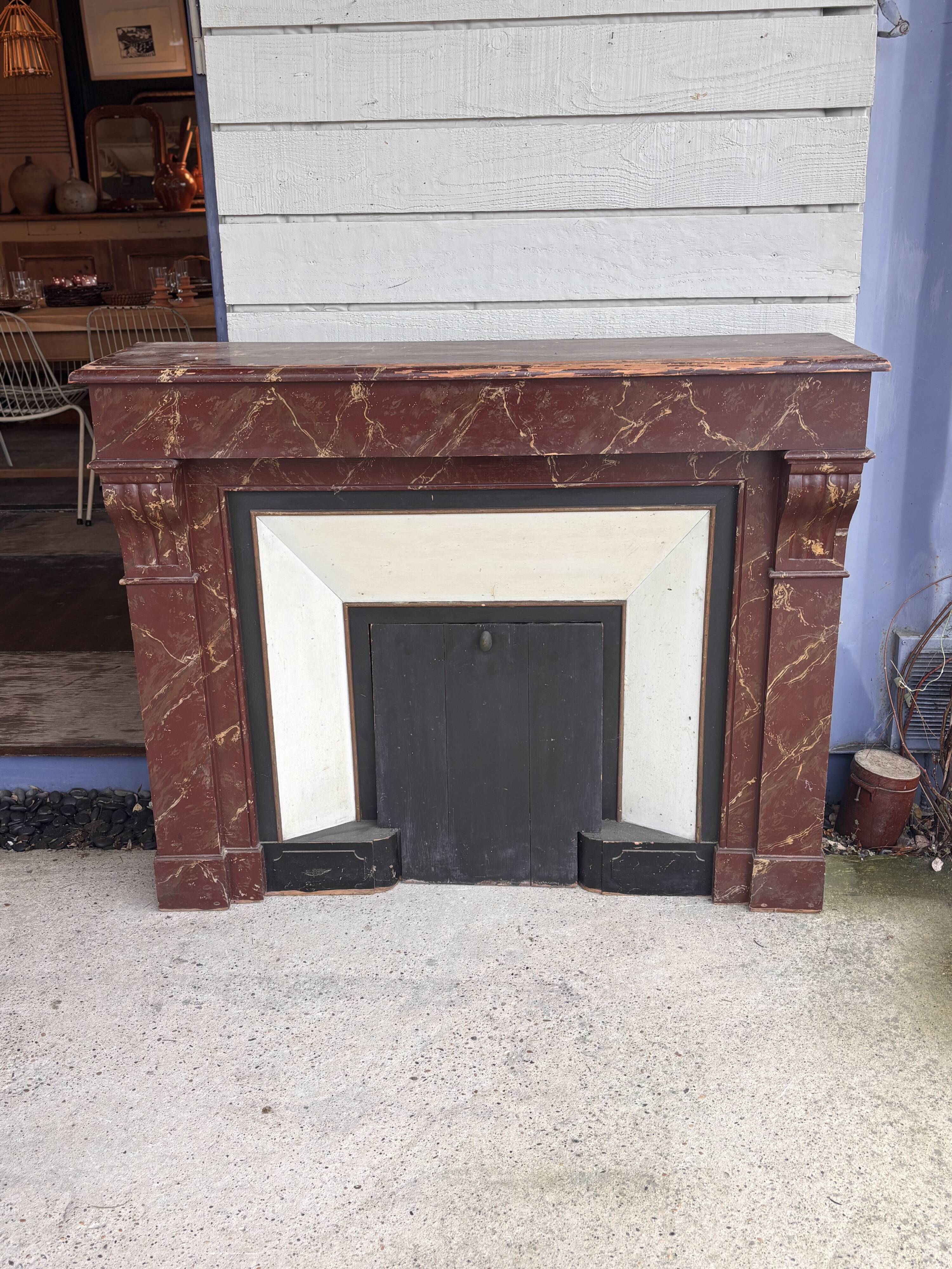 Wooden fireplace mantel imitating marble