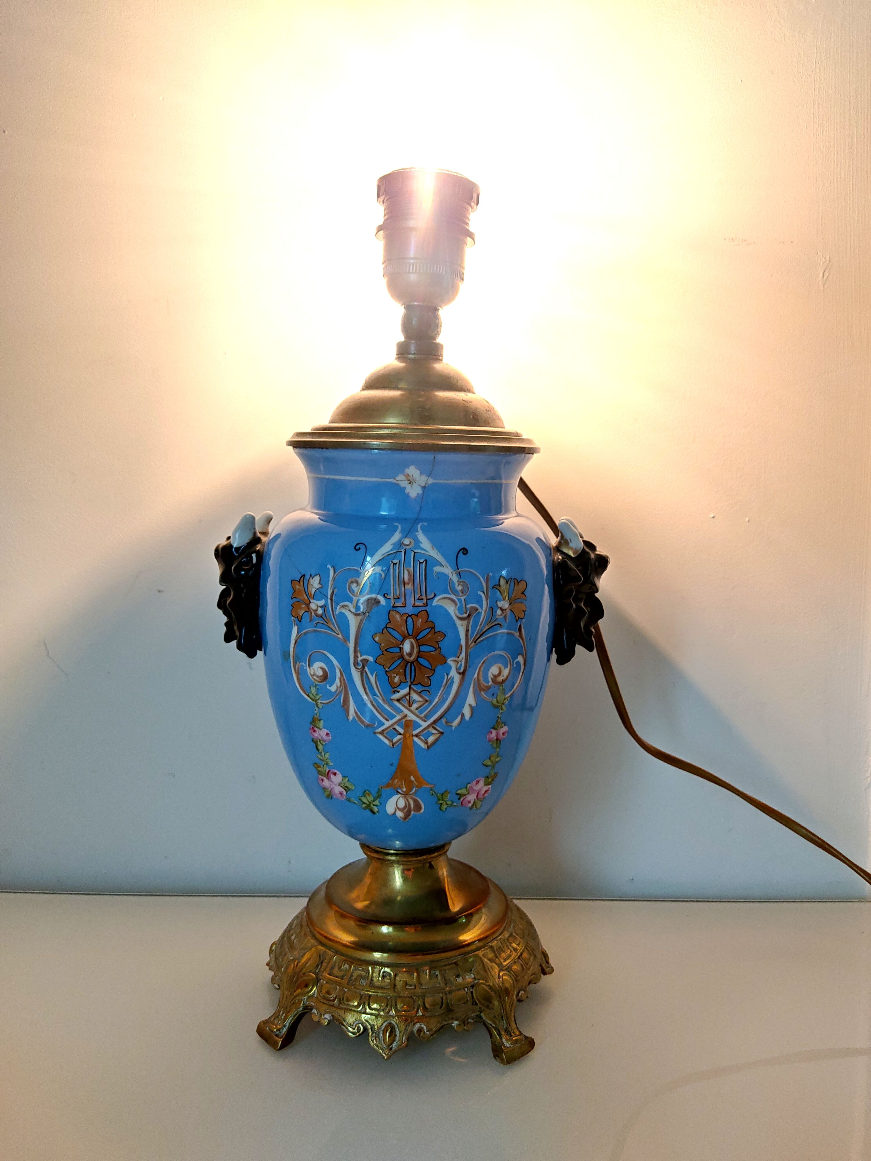 Lamp foot blue vase heads of fauna