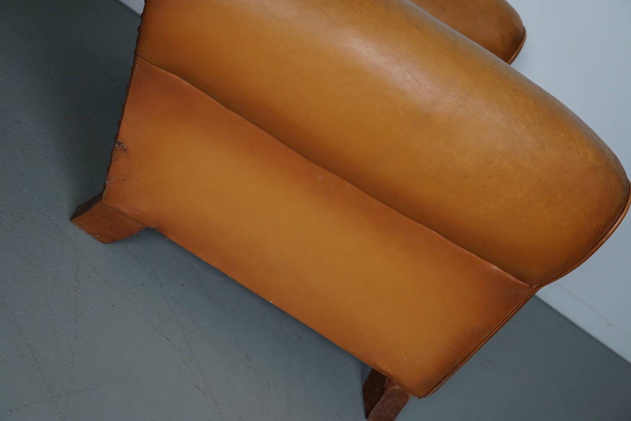 Pair of French Cognac Moustache Back Leather Club Chairs, 1950s