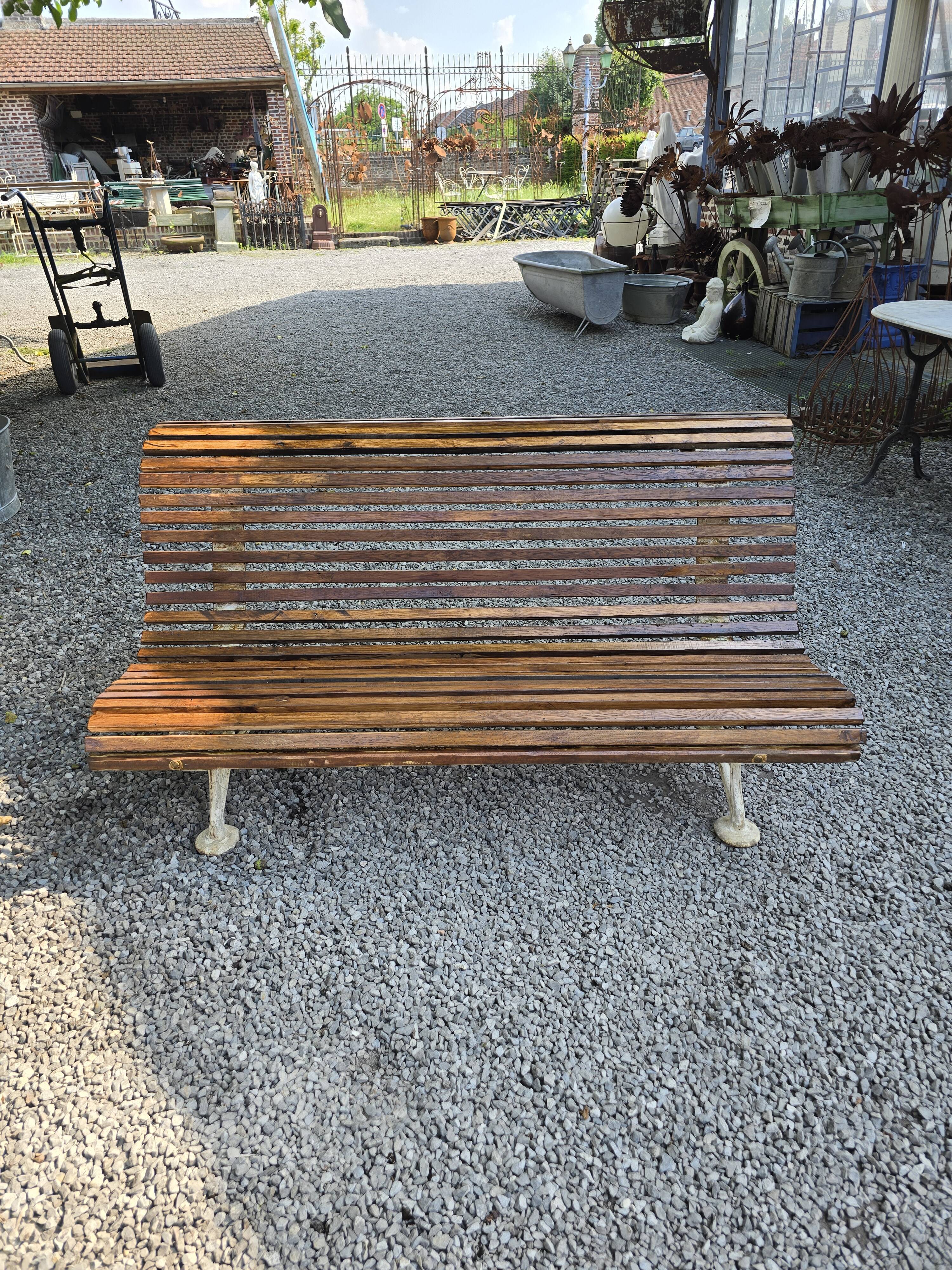Garden bench with cast iron legs and oak slats