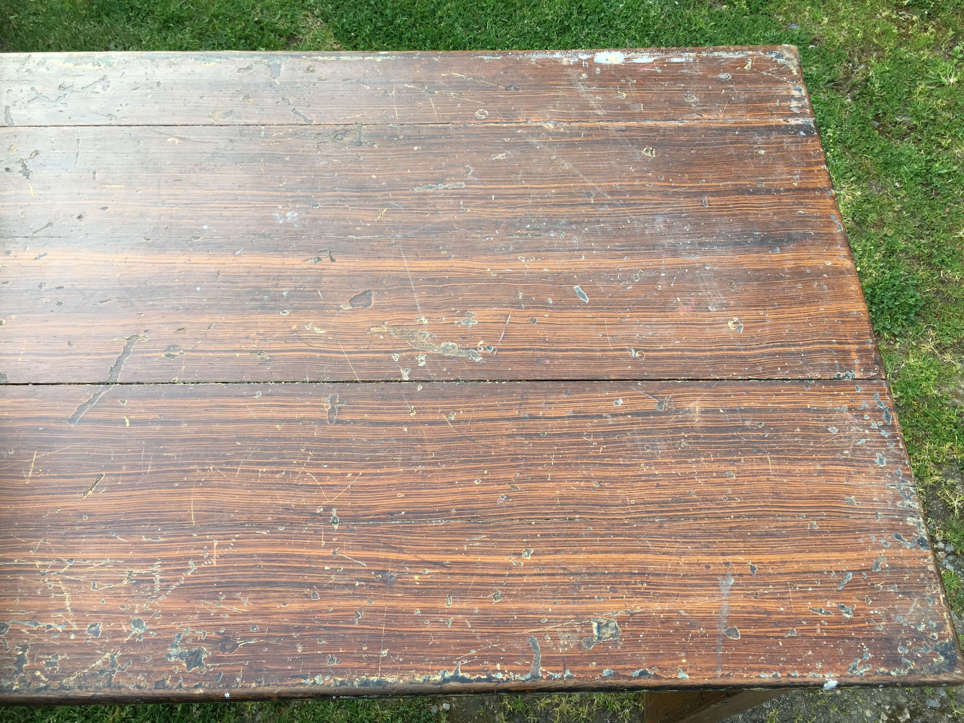 Old farmhouse table in oak painted faux wood old painting.