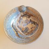 Empty pocket bowl cup on ceramic pedestal with signed spike holes