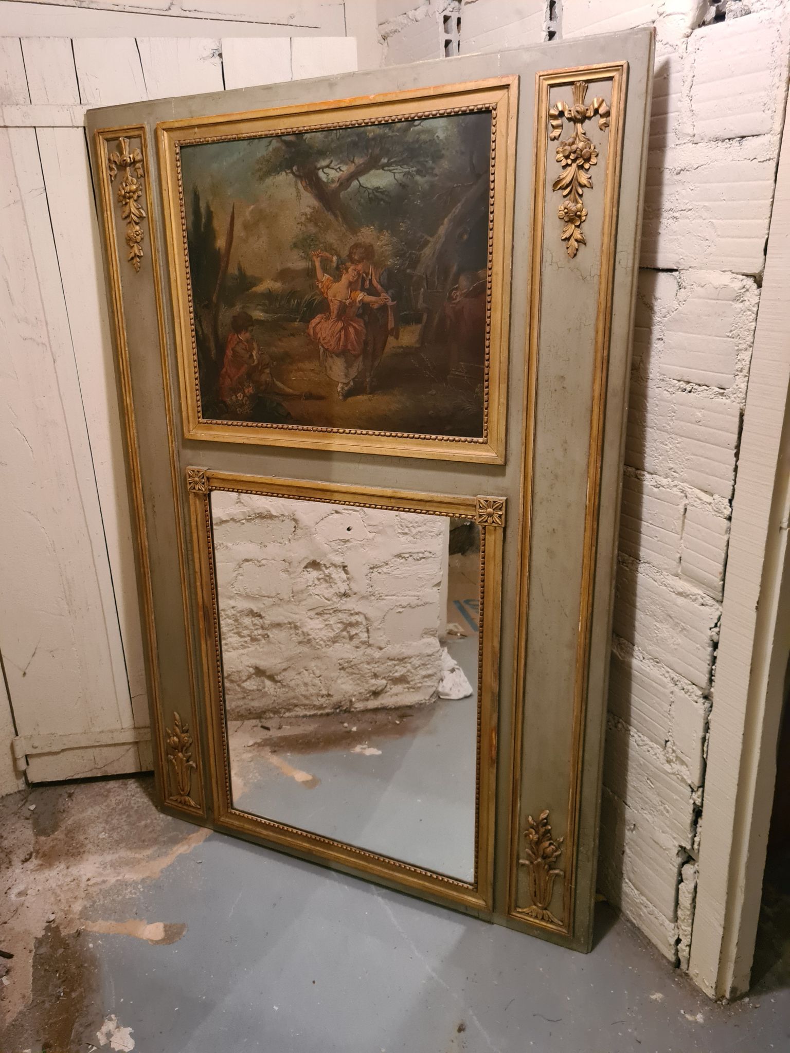 Lacquered wooden trumeau in the Louis XVI style, late 19th century.