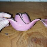 A pair of pink earthenware candlesticks (1940s–50s)