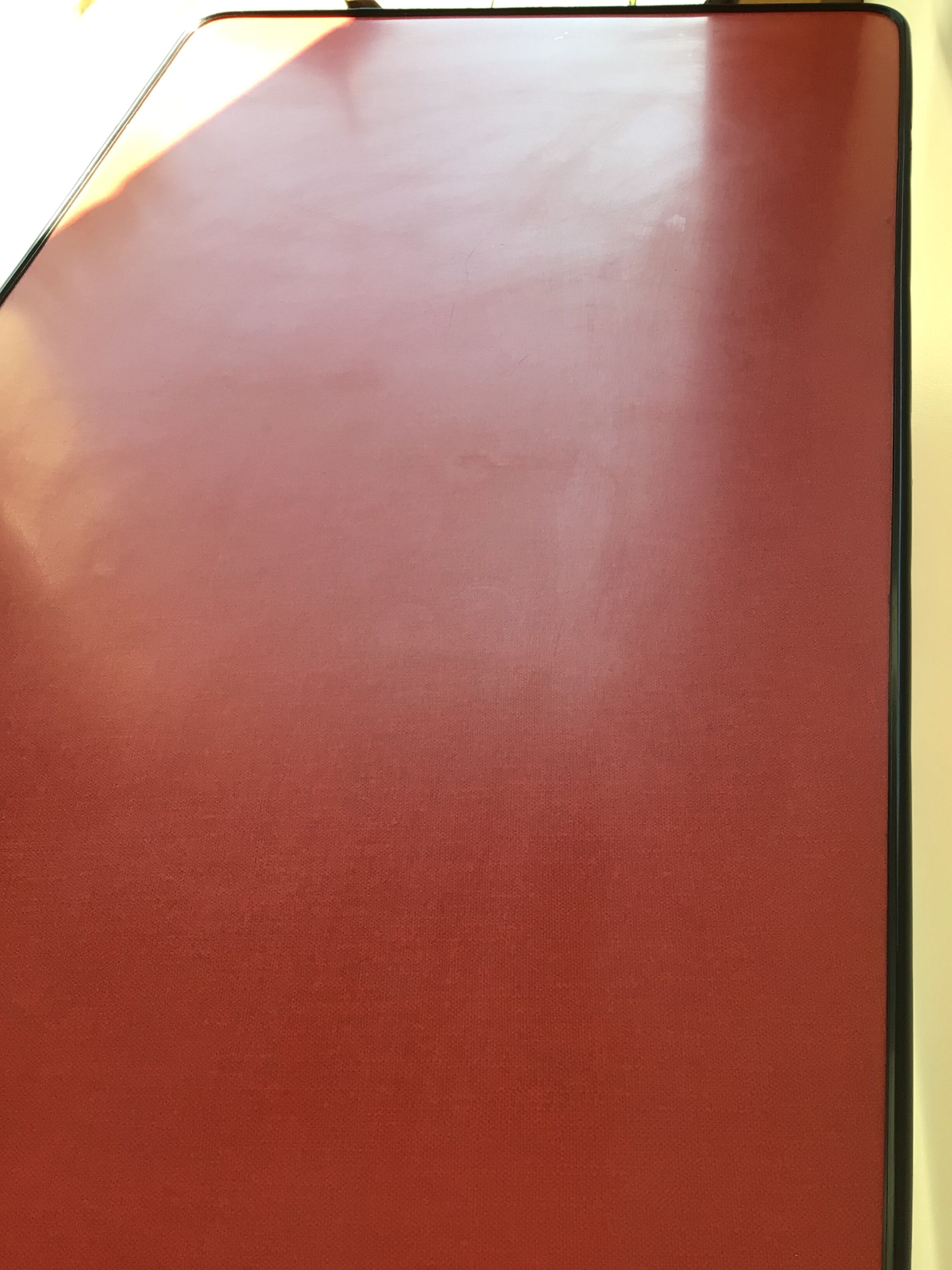 Double-footed red Formica wood spindles console