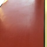 Double-footed red Formica wood spindles console