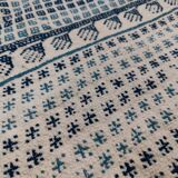 White and blue handwoven rug in natural wool
