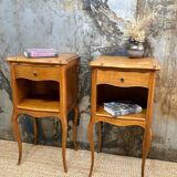 Pair of bedside tables with crossbow base
