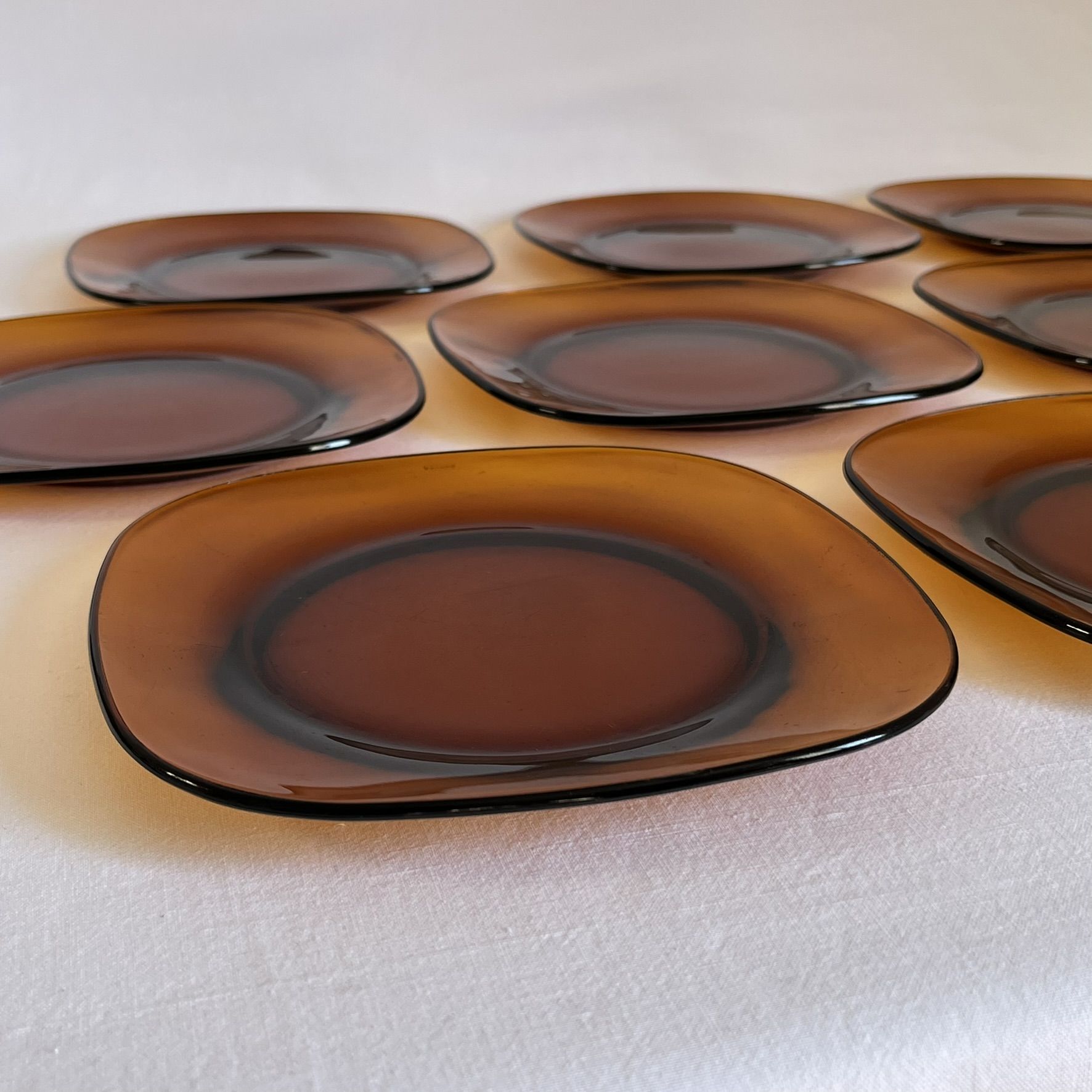 Set of 10 square Vereco plates in amber glass