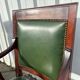 Paire de fauteuils de style Empire en acajou et cuir vert