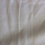 Old white tablecloth in thread with tangles of embroidered days central monogram