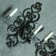 Two large wrought iron wall lights