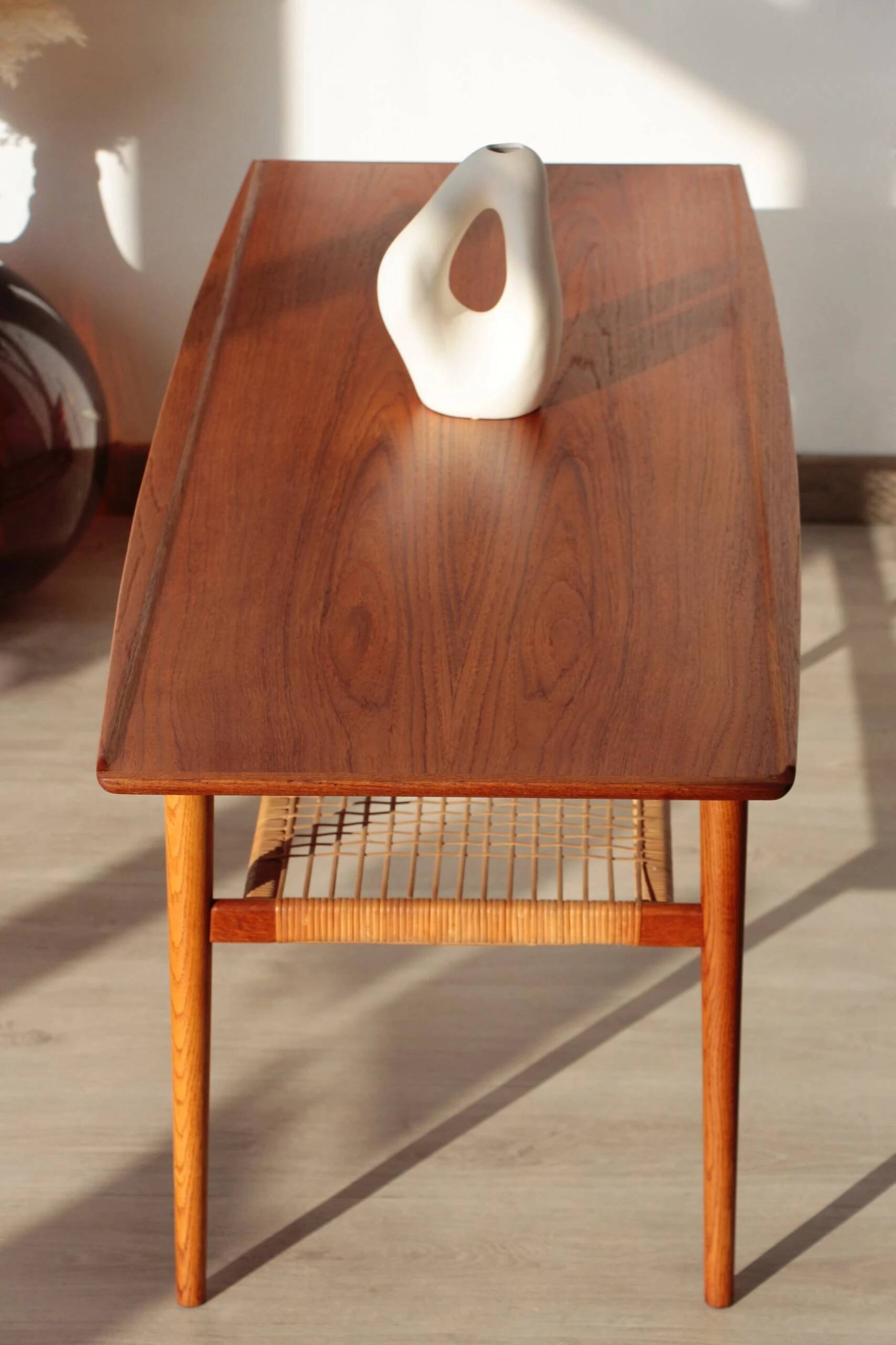 Vintage Scandinavian coffee table in teak and rattan – Danish design from the 1960s.