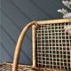 Steel and wicker wall shelf