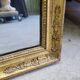 GOLDEN WOODEN MIRROR WITH PALMETTES FROM THE 19TH CENTURY