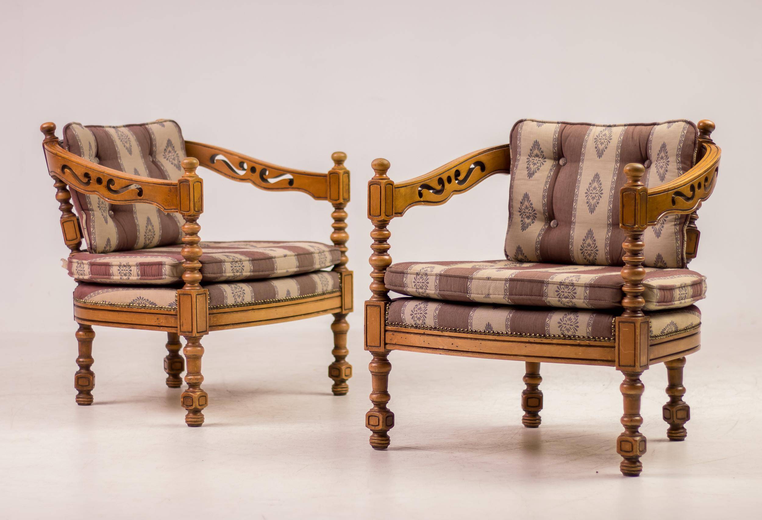 Pair of Giorgetti "1975 Gallery" armchairs in carved wood, original upholstery.