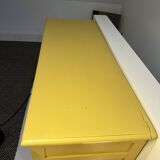 Yellow wooden chest of drawers