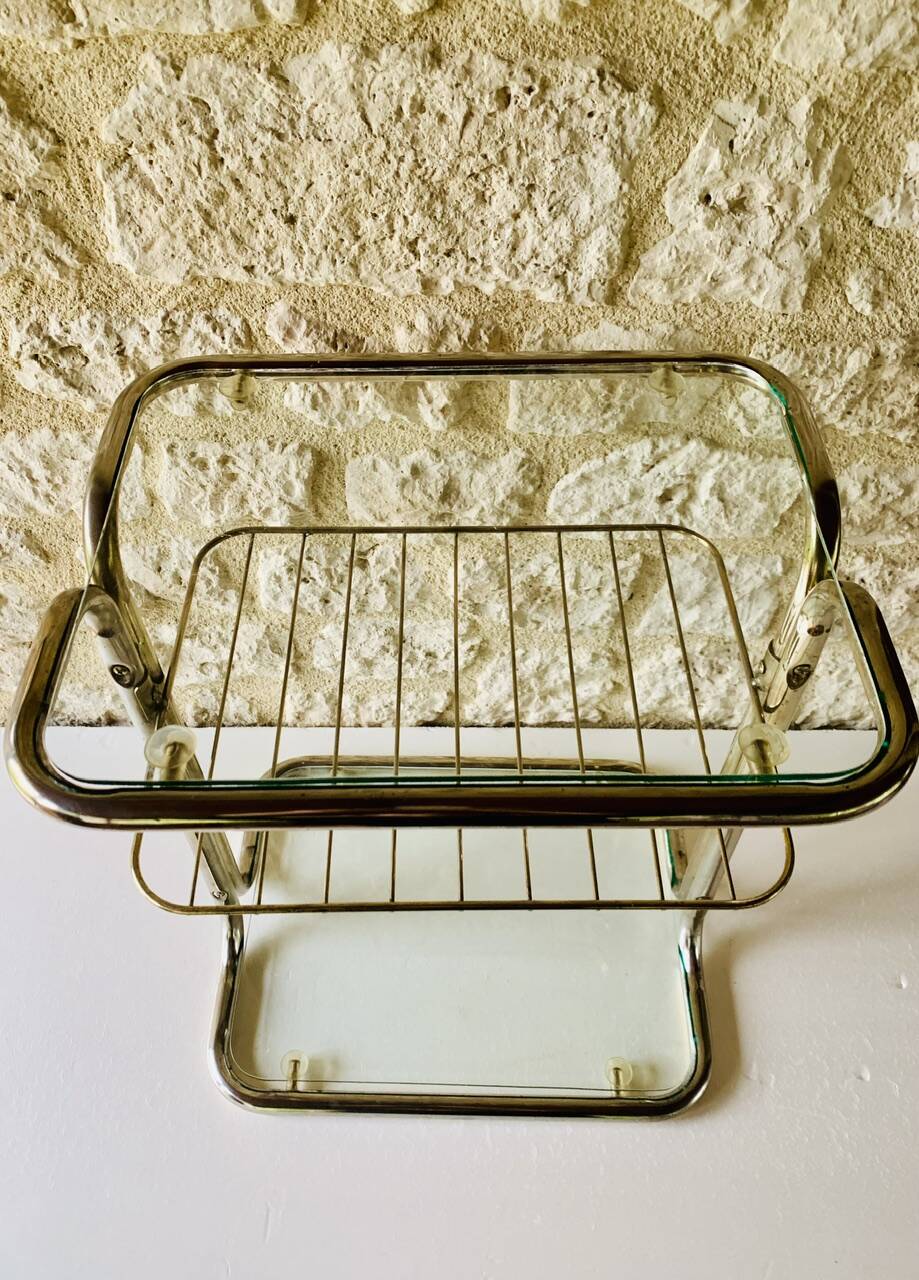 Glass and brass side table with magazine rack, circa 1970's