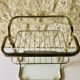 Glass and brass side table with magazine rack, circa 1970's