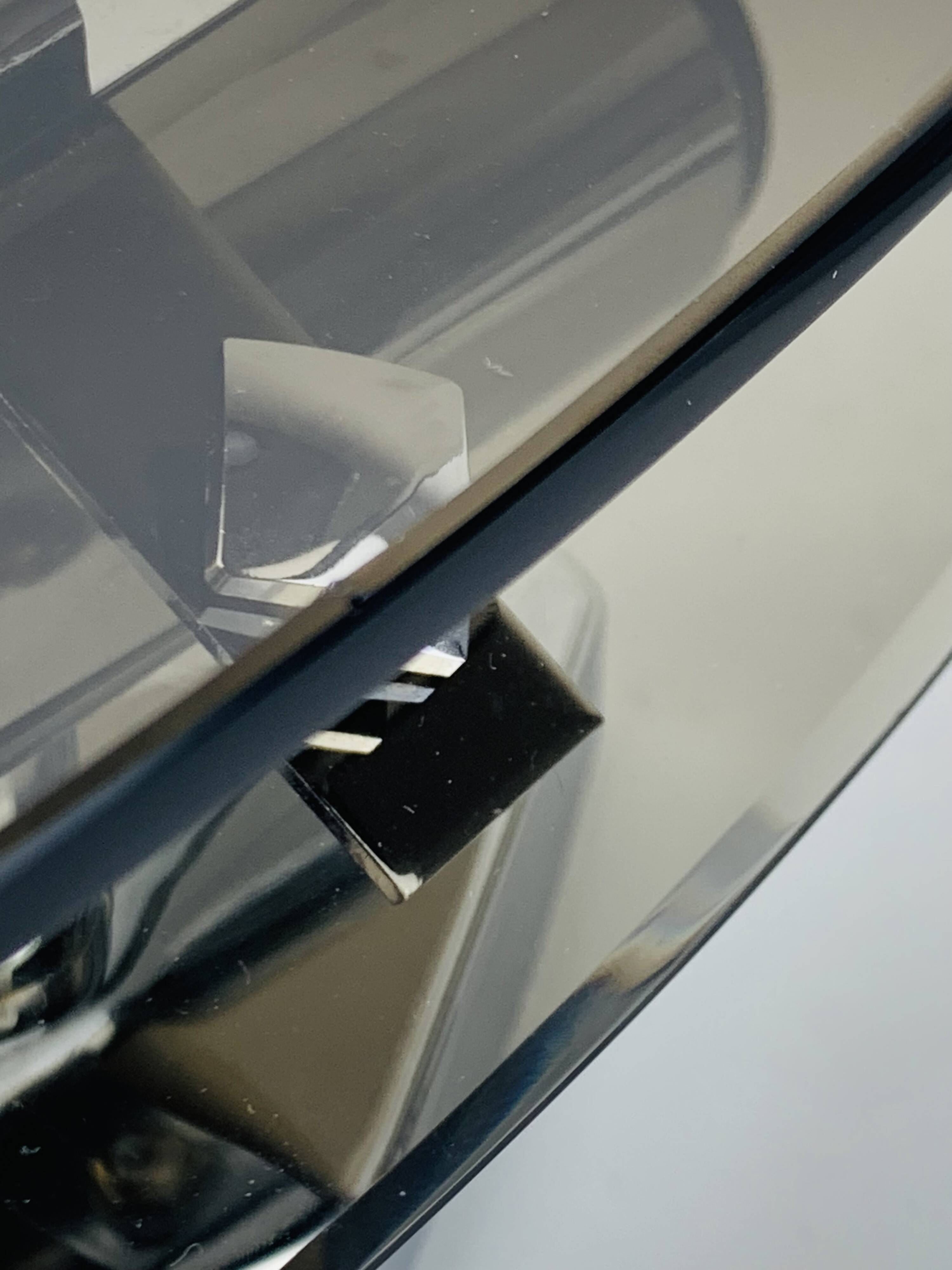 Pair of smoked glass and chrome wall lights from the 1970s.