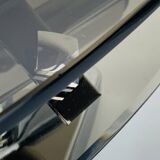 Pair of smoked glass and chrome wall lights from the 1970s.