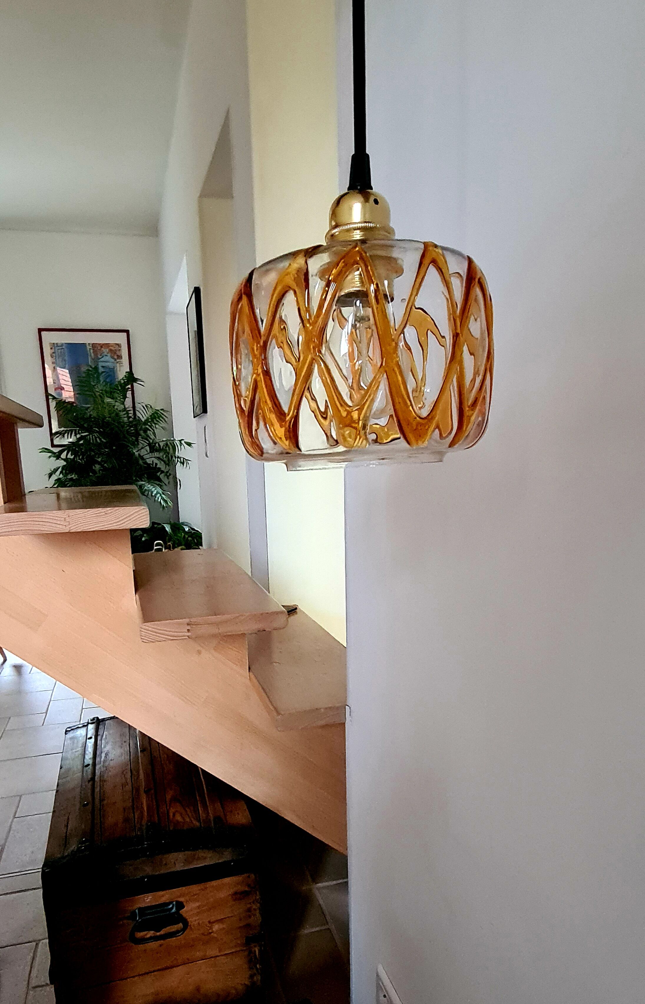 Amber blown glass suspension
