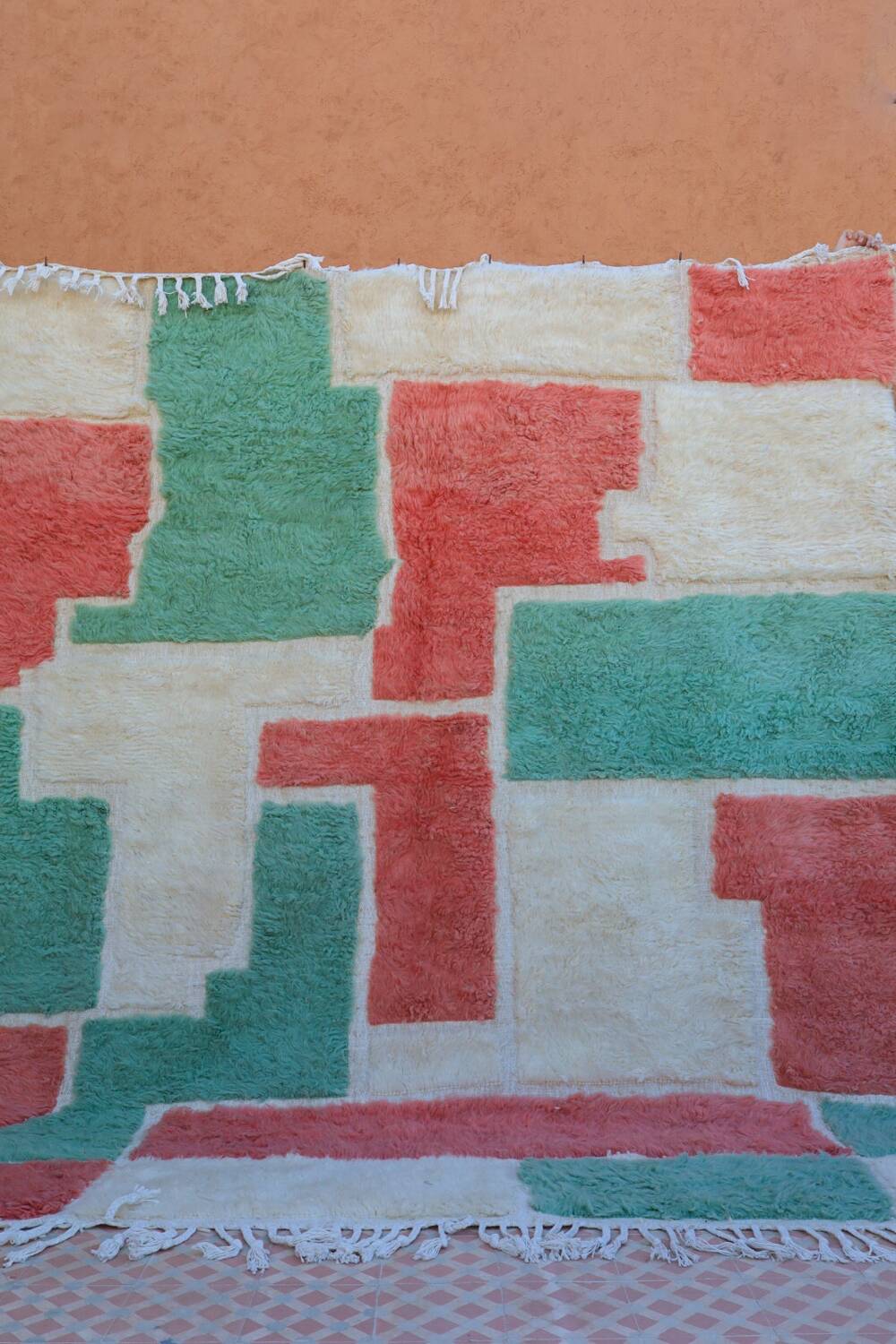 Moroccan Berber rug in green and pink.