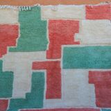 Moroccan Berber rug in green and pink.