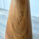 Minimalist side table in solid suar wood with conical legs.