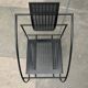 Postmodern black Quinta chair in perforated metal by Mario Botta for Alias, 1980s.