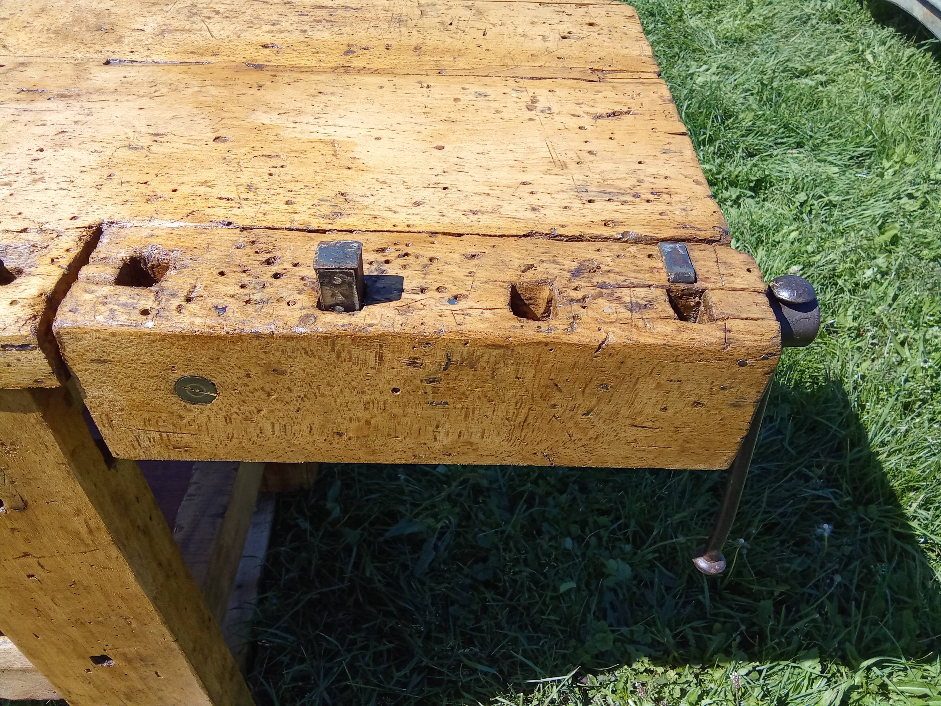 Old solid wood carpenter's bench with 2 functional vices.