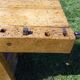 Old solid wood carpenter's bench with 2 functional vices.