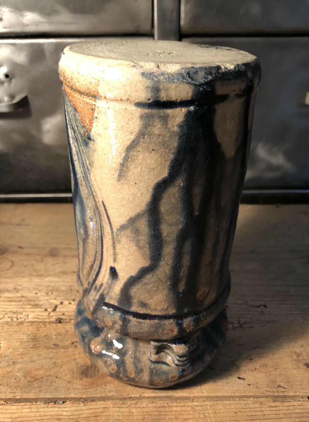 Enamelled pottery vase signed